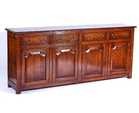 An 18TH CENTURY STYLE OAK DRESSER BASEWith four drawers over four arch panel cupboards, 208cm wide; 89cm highCondition report