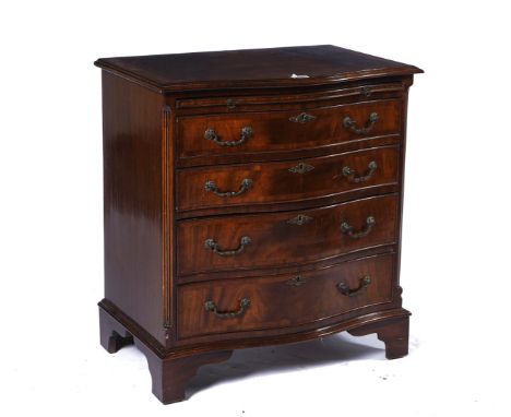 A GEORGE III STYLE SMALL MAHOGANY SERPENTINE CHESTWith brushing slide over four long graduated drawers, on bracket feet, 71cm