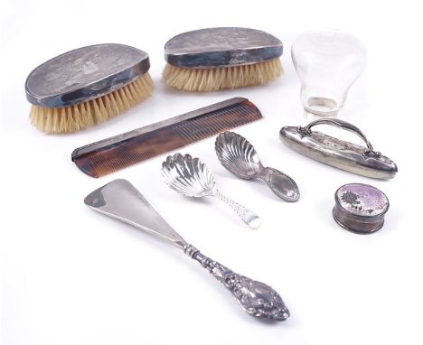 A GROUP OF SILVER MOUNTED WARES (9)Comprising; a pair of oval hairbrushes, Birmingham 1949, a comb, a glass bottle having a s