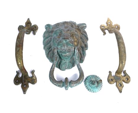 A GILT-METAL LION MASK DOOR KNOCKER AND A PAIR OF DOOR HANDLES (3)The door knocker, 21cm and the handles, 23cmCondition repor