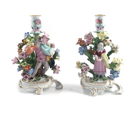 A PAIR OF MEISSEN PORCELAIN CHAMBER CANDLESTICKS (2)Circa 1900Modelled with a man and woman standing before a flowering bocag