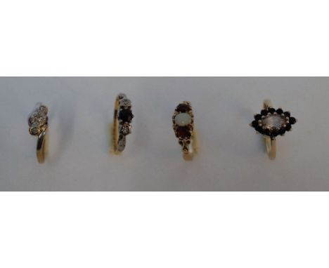 AN 18CT GOLD, SAPPHIRE AND DIAMOND THREE STONE RING AND THREE FURTHER GOLD AND GEM SET RINGS (4)The 18ct gold, sapphire and d