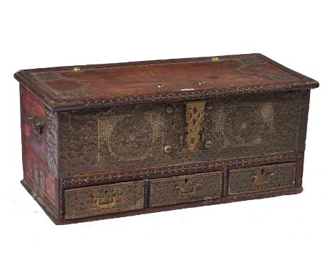 A 19TH CENTURY BRASS STUDDED AND VENEERED HARDWOOD ZANZIBAR CHESTThe lift top over three drawers, 109cm wide; 48cm highCondit