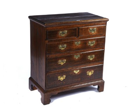 A MID 18TH CENTURY OAK CHESTWith two short over three long graduated drawers, on bracket feet, 90cm wide; 103cm high