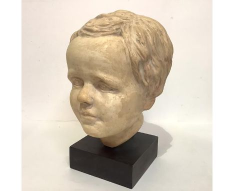 20th Century School, Portrait Bust of a Young Boy, plaster, unsigned, mounted on an ebonised plinth. Overall 28cm