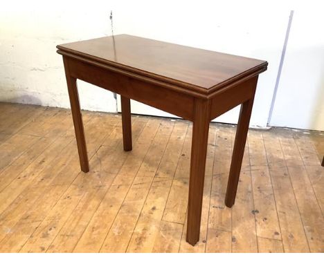 A George III mahogany foldover card table, the rectangular top above a concertina action, on channel-moulded square section l