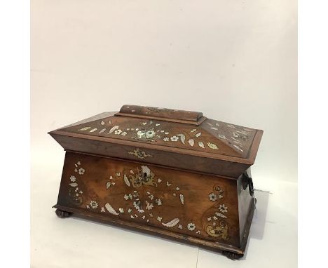 A large mid-19th century rosewood sarcophagus tea caddy, elaborately inlaid in abalone and mother of pearl in floral and foli