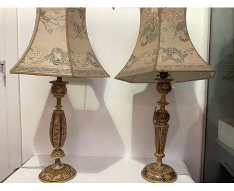 A pair of vintage painted papier mache table lamps, of pierced baluster form, polychrome decorated with flowers and leaves. H