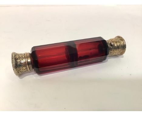 A mid-19th century silver-gilt mounted ruby glass double-ended scent flask, Sampson Mordan, London 1866, the faceted cylindri