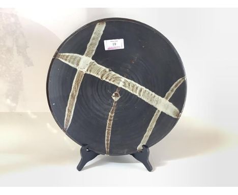 Janet Leach (American, 1918-1997), a large studio pottery charger, impressed seal marks. Diameter 37cm