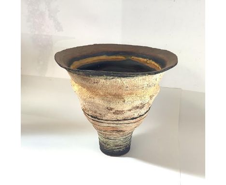 Robin Welch (1936-2019), a stoneware vase, of tapering circular form, textured with "volcanic" banding, impressed mark. 23.5c