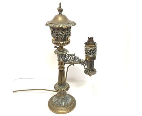 A handsome 19th century brass Colza lamp, the urn-form reservoir with flame finial, the body pierced and cast with grapes and