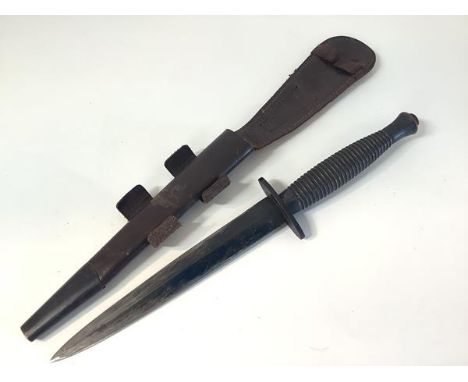 A World War II 3rd Pattern Fairbairn-Sykes 'B2' Commando fighting knife, the hilt with ribbed grip, the oval cross guard stam