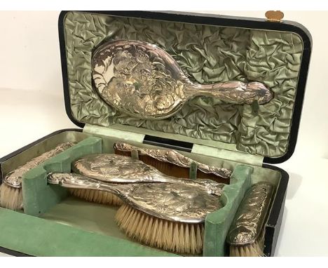 An Edwardian silver-mounted cased dressing table set, Walker &amp; Hall, various dates, Chester 1906 and Sheffield 1907 and 1