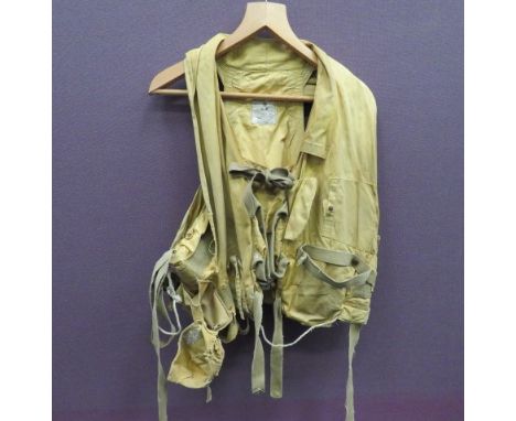 1941 Pattern RAF Mae West yellow drill material vest. Tan canvas light pocket to the right side. Left side mirror pocket. Rea