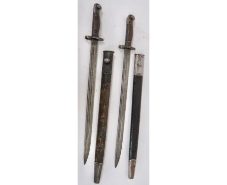 Two WW1 British SMLE 1907 Bayonets 17 inch, single edged blades with narrow fullers. The fortes stamped "Wilkinson 8/17" and 