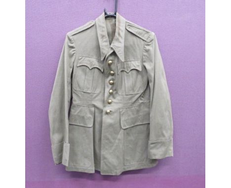 Mid 20th Century French Tropical Tunic khaki green cotton, single breasted, fold over collar tunic. Turn back cuffs. Pleated 
