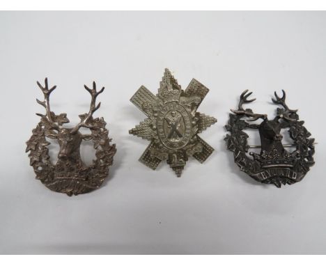 Two Gordon Highlanders Officer Badges consisting silver ivy wreath with lower scroll. Central stag's head (part of antler bro