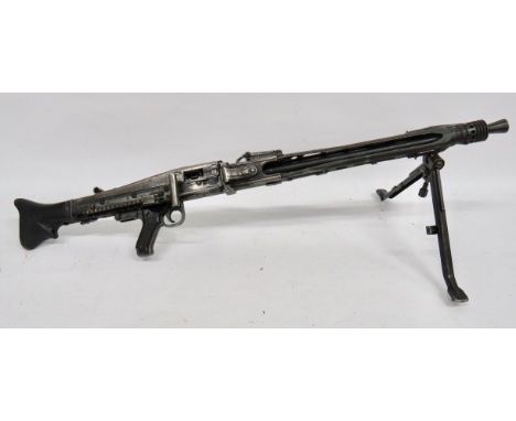Deactivated MG42 Yugoslavian Light Machine Gun 7.92 mm, 24 inch barrel with front flash hider. Square form barrel shroud. Top