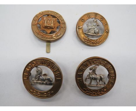 Four Various Infantry Home Service Helmet Plate Centres consisting bi-metal Lincolnshire (4 loops)... Bi-metal Warwickshire (