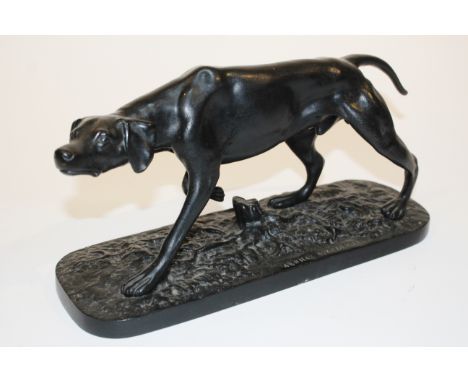 A RUSSIAN CAST IRON MODEL of a pointer on a naturalistic base inscribed in cyrillic, 30cm wide