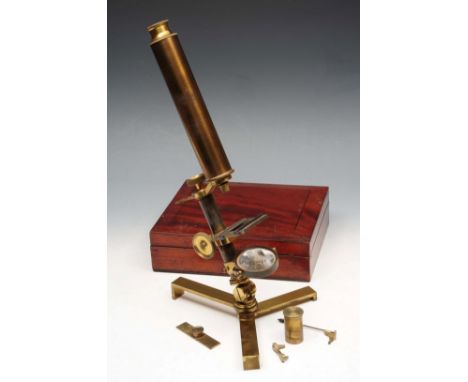 A BRASS MONOCULAR MICROSCOPE by W.E. & F. Newton, Instrument Makers and Globe Manufacturer's, London in a mahogany box, 25cm 