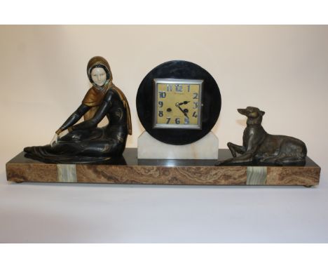 A FRENCH ART DECO SLATE, MARBLE AND SPELTER MOUNTED MANTEL CLOCK, the square dial inscribed 'A Foucher, Louviers', flanked by