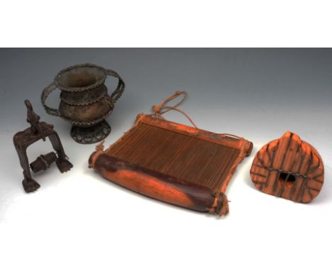 AN ASHANTI BRONZE TWO HANDLED BOWL on pierced stand, 15cm high; a metal spool holder in the form of a cockerel, a wooden loom