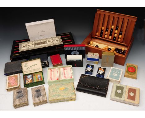 A COLLECTION TO INCLUDE: a backgammon board, a large quantity of playing cards, 'The Captains Mistress' game and associated i