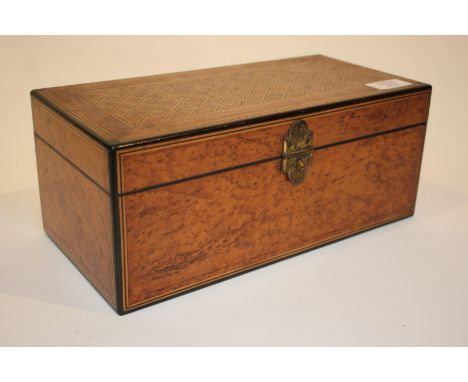 A VICTORIAN BURR WOOD AND PARQUETRY INLAID TEA CADDY with hinged rising lid, engraved hasp and trellis work top, 30cm wide