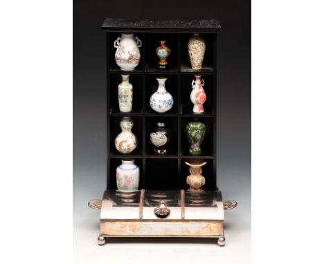 A SILVER PLATED DESK STAND with scallop shell handles, twin glass inkwells and ebony rule, 24cm; and a set of eleven miniatur