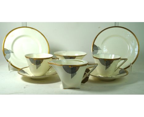 Royal Doulton Tango six setting tea service
Having Art Deco decoration with gilt rims, comprising milk jug, sugar bowl, twin 