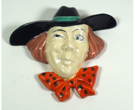 Royal Dux ceramic wall mask
Modelled in the form of a winking male wearing a hat and bow tie, printed factory marks to base, 