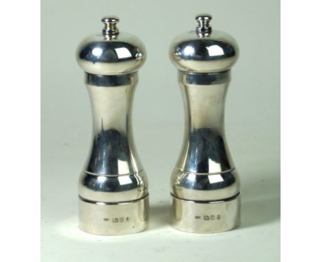 A modern matched pair of salt and pepper mills
Of plain tapered form, by John Bull Ltd., Sheffield 1989-1990, height 15.4cm, 