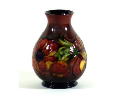 Walter Moorcroft flambé pottery vase of bulbous form
Decorated in the Anemone pattern on a deep flambé ground, impressed fact