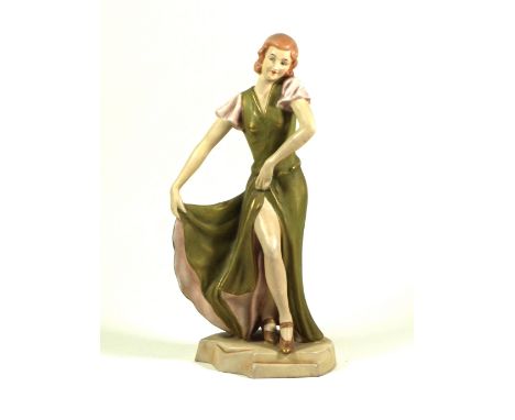 Art Deco Royal Dux figurine
Depicting a 1930's dancing girl, embossed factory marks to base, height 26cm
 CONDITION REPORT: L
