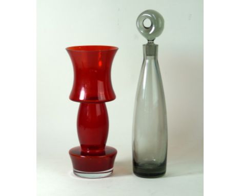 Post war conical glass decanter with moon stopper
Finished in a smokey grey colourway, height 36cm, together with a Riihimaki