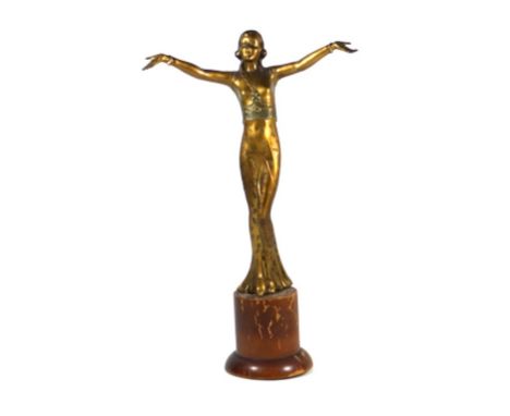 An Art Deco gilt spelter figure of a dancing girl
Modelled wearing a typical Art Deco flowing dress, raised on hardwood plint