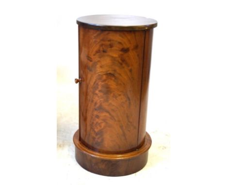 A Victorian style mahogany cylindrical pedestal pot cupboard
The hinged door enclosing single shelf, raised on pedestal base,