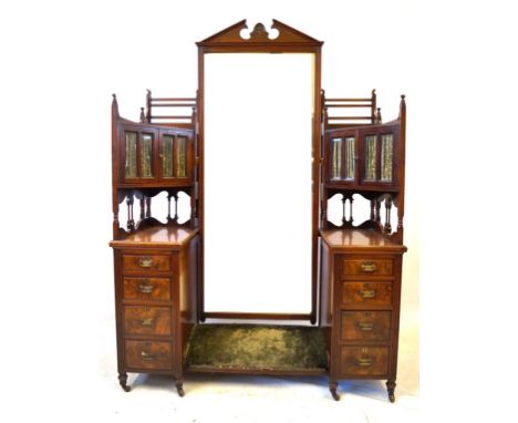 A good quality late Victorian walnut dressing table
The central full length bevelled mirror pivoted between bevelled glazed p
