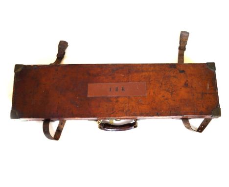 A leather covered shotgun case
Baize lined interior with label for WC Carswell, gun maker, Chapel Street Liverpool, fitted in