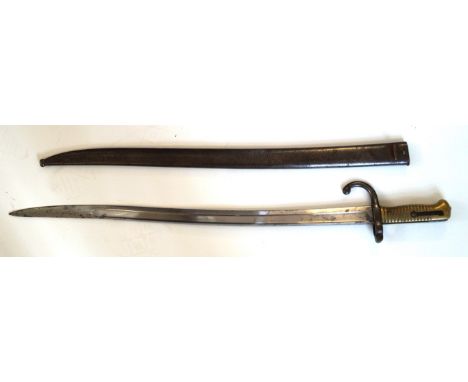 A French chassepot bayonet, dated 1874
57.5cm yataghan blade with brass grips, complete with metal scabbard.