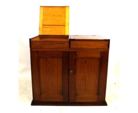 A late Victorian/Edwardian pitch pine side cupboard
The rectangular form featuring lift-up and fall-flap panel revealing shal