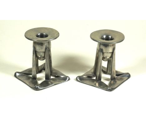 English pewter for Liberty & Co pair of pewter candlesticks
Each modelled in the form of bullet shaped holders raised on four