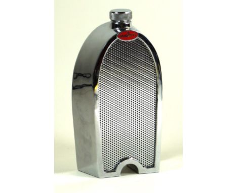 A Bugatti radiator decanter late 20th Century
Ruddspeed-type, in the form of a chrome Bugatti radiator with red enamel badge,