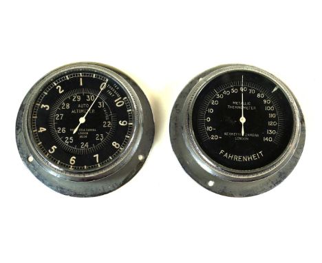 A Negretti & Zambra of London auto altimeter 20th Century
The chrome mounted gauge with black face and white numerals, simila