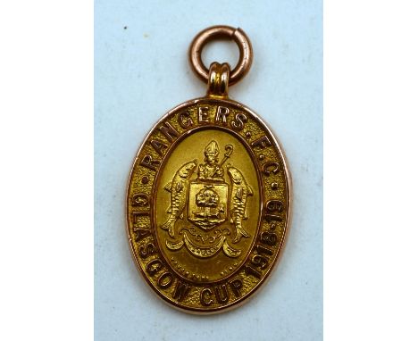 A 1918-19 Glasgow cup nine carat gold medal, to the obverse Rangers FC, to the reverse sergt J E Gordon, with suspension ring