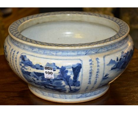 A large Chinese blue & white pottery planter/jardiniere of large form, decorated with landscape panels, and character marks t