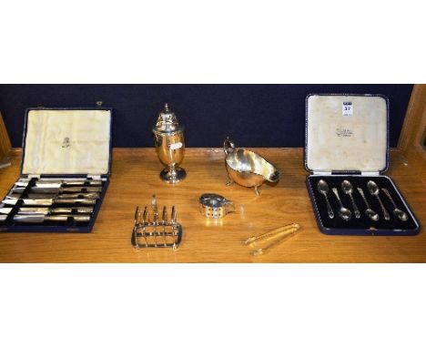 A set of six silver teaspoons, hallmarks for London, also with six silver handled butter knives, hallmarks for Sheffield, pla