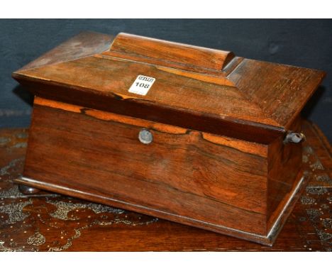 A Victorian rosewood sarcophagus shaped tea caddy, with integral lead lined compartments, lacking mixing glass, escutcheon's 
